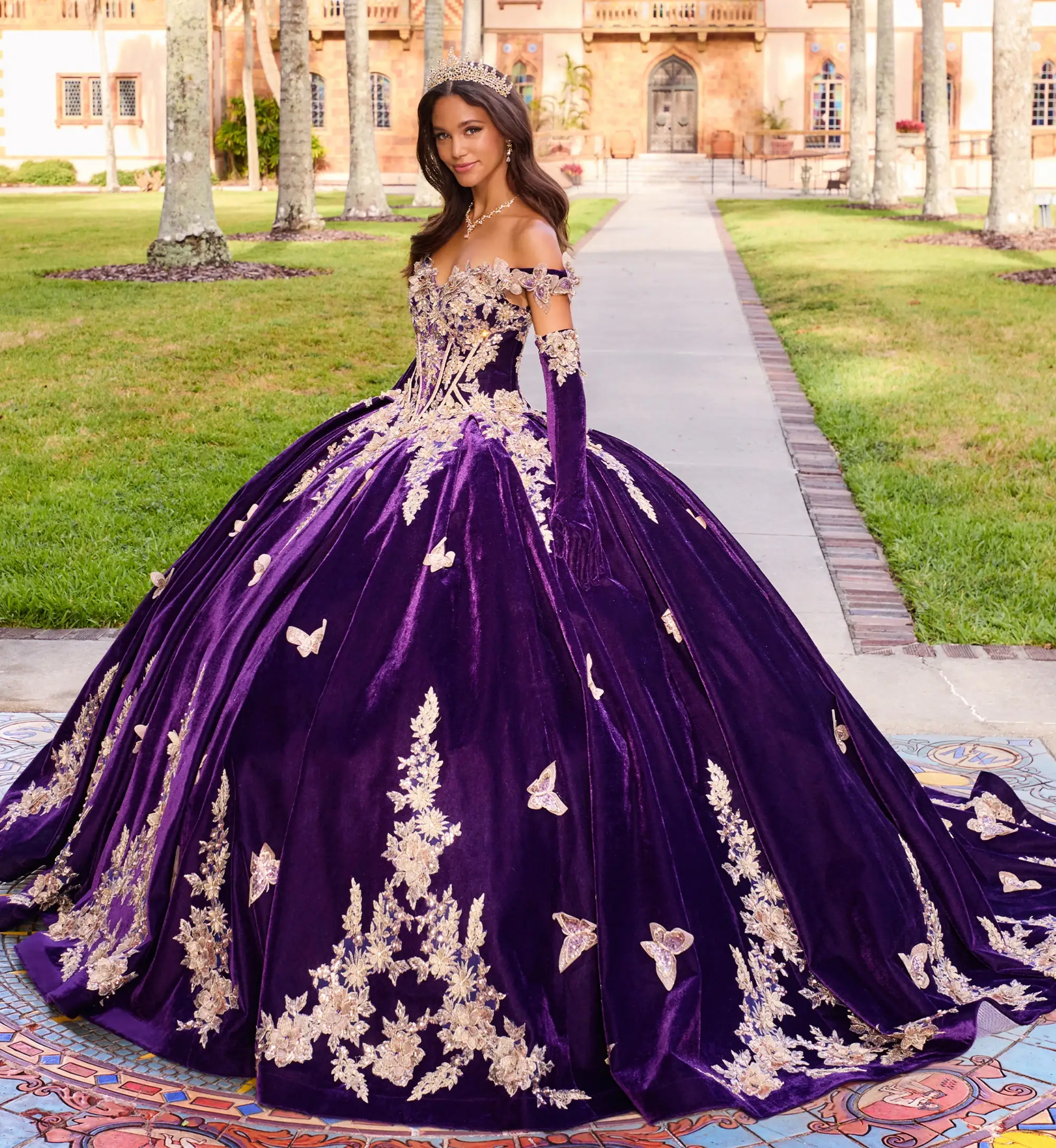 model is wearing a dark purple quince gown