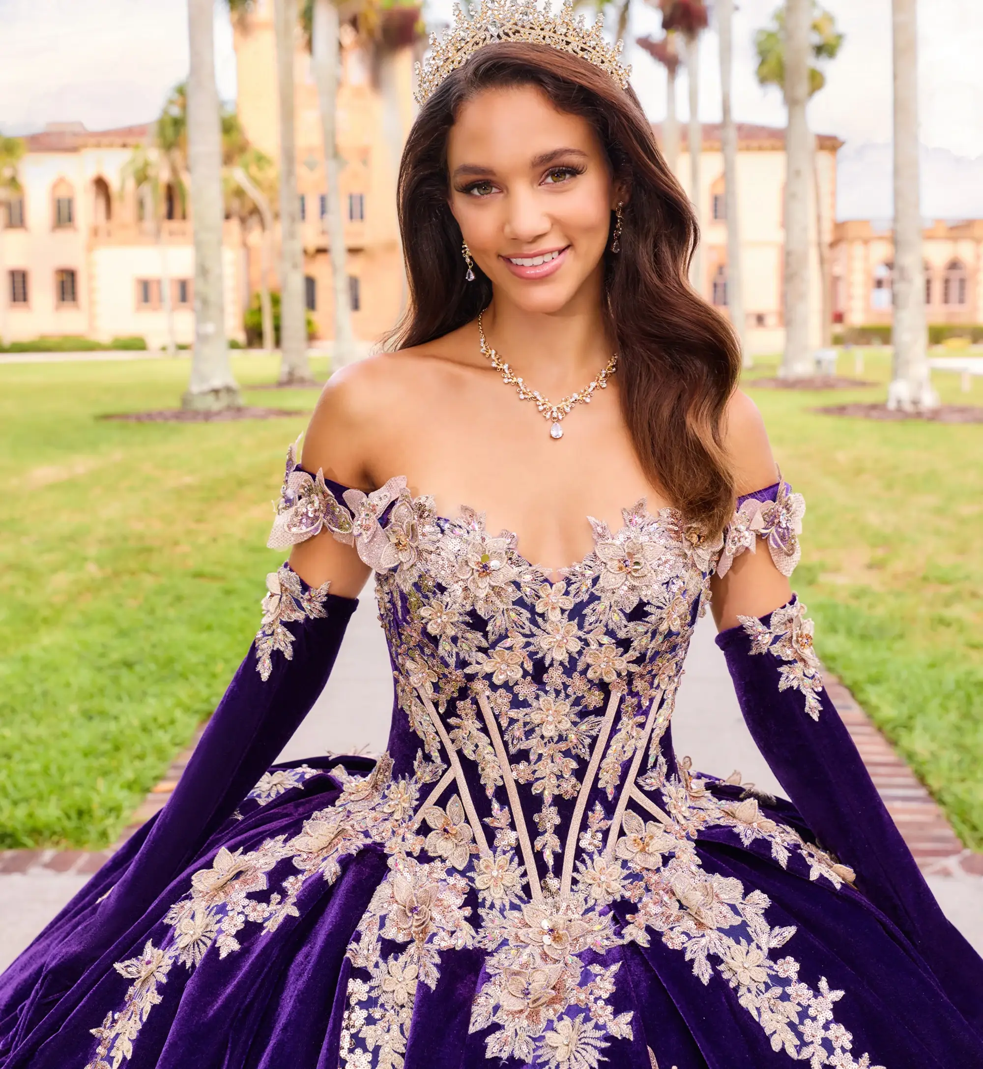 model is wearing a dark purple quince gown