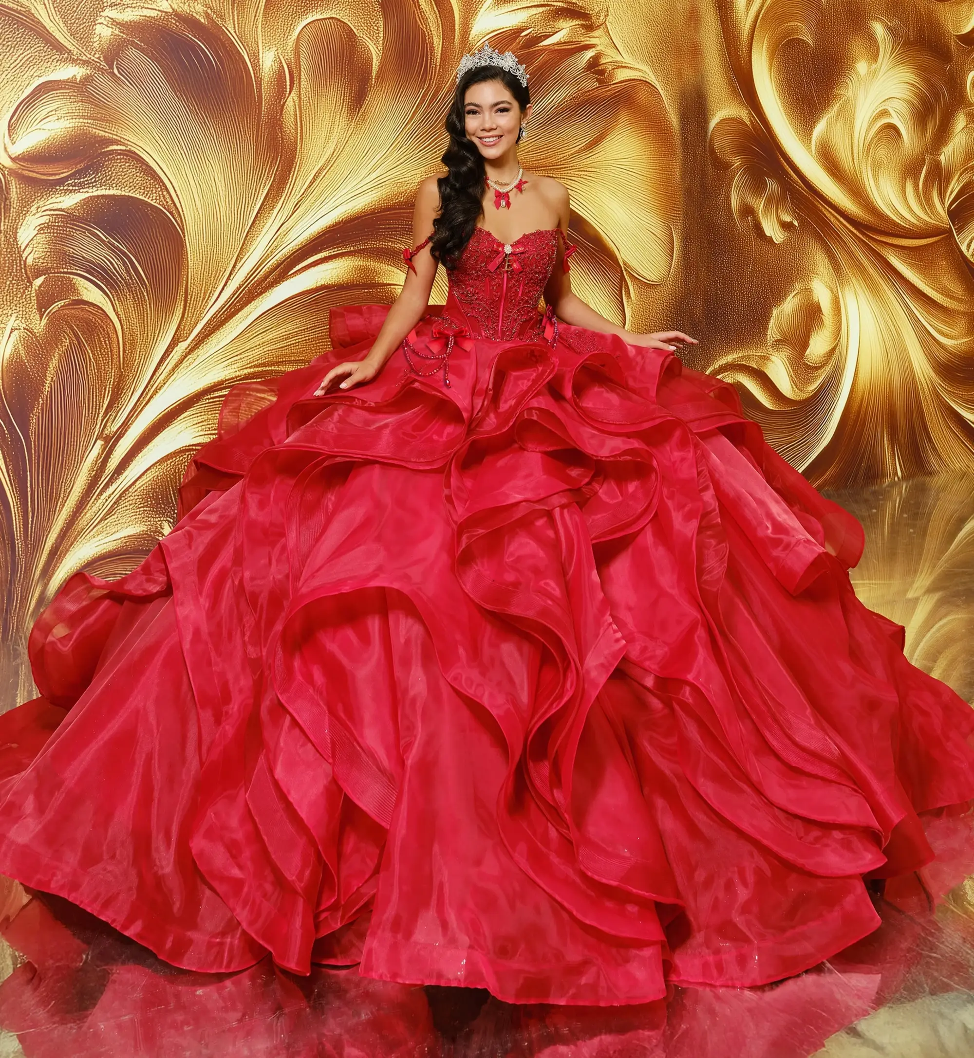 model is wearing an off the shoulder red quince gown