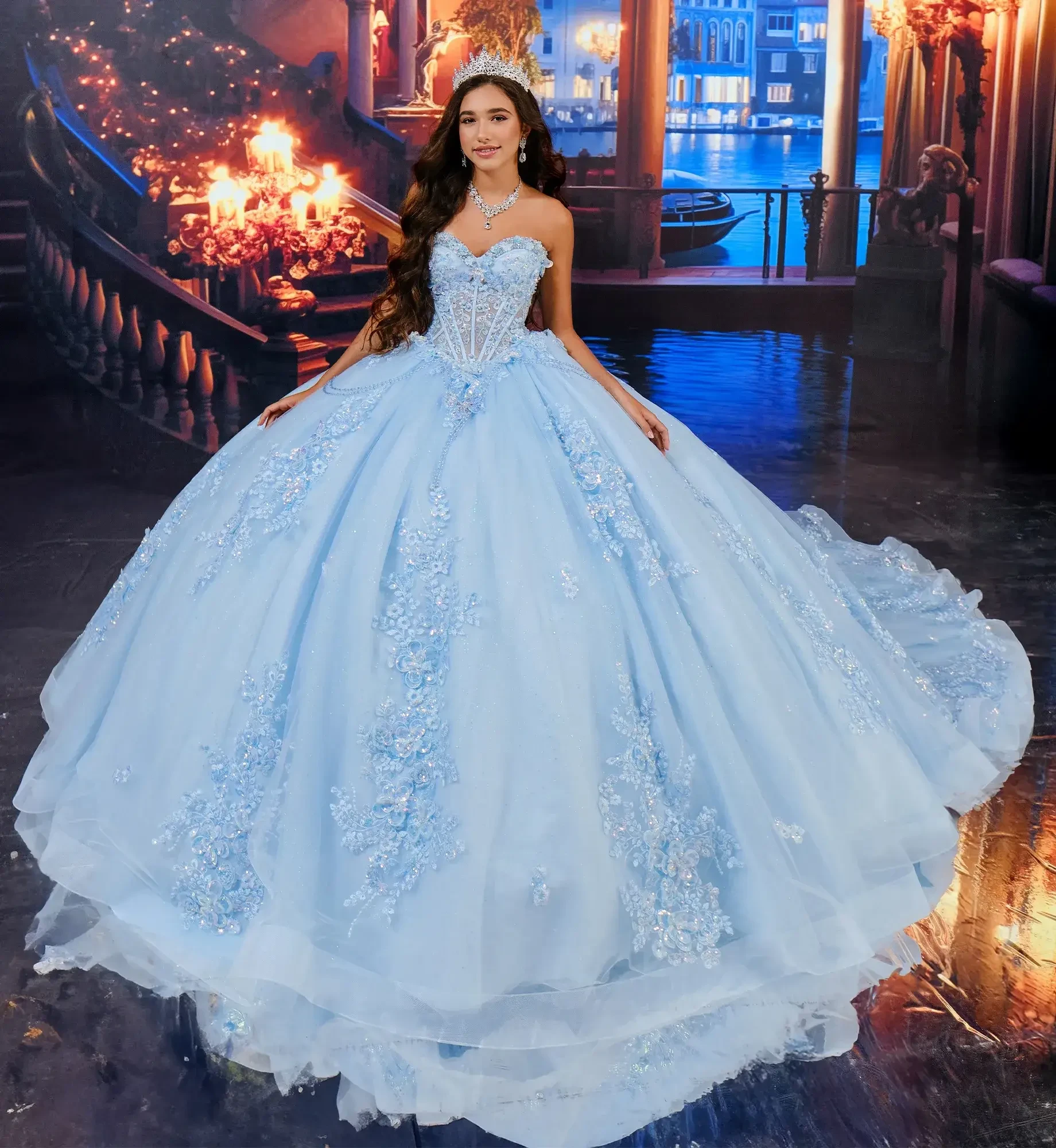 model is wearing a strapless light blue quinceanera dress