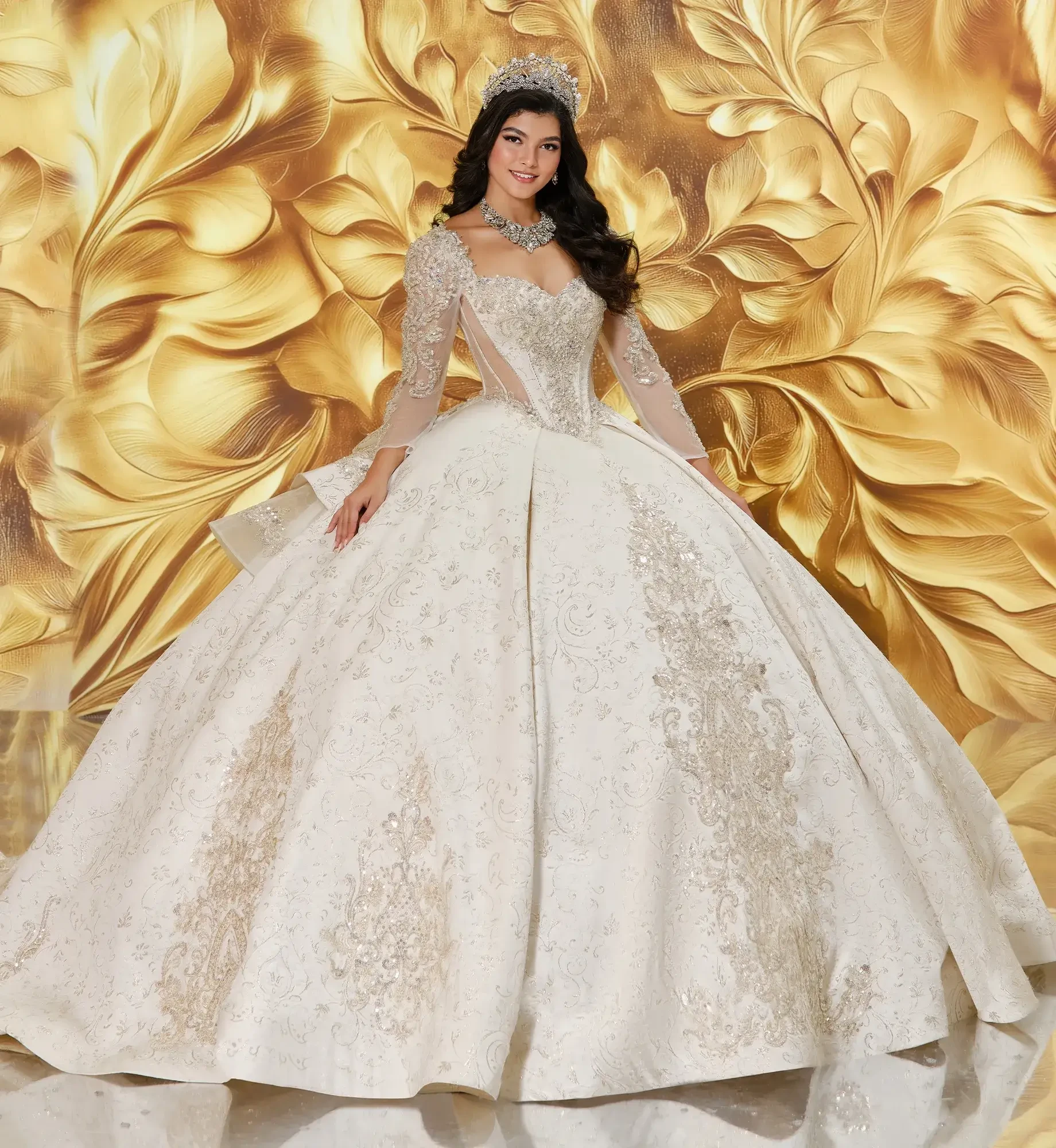 model is wearing a light gold long sleeve quince gown