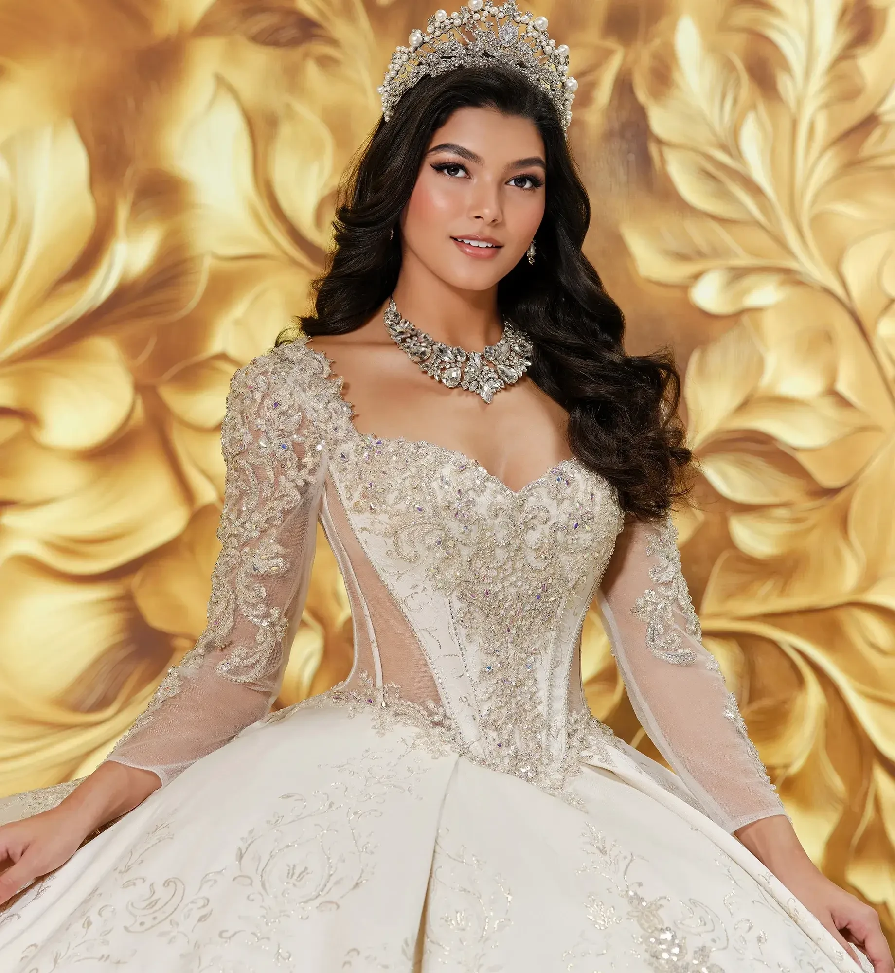 model is wearing a light gold long sleeve quince gown
