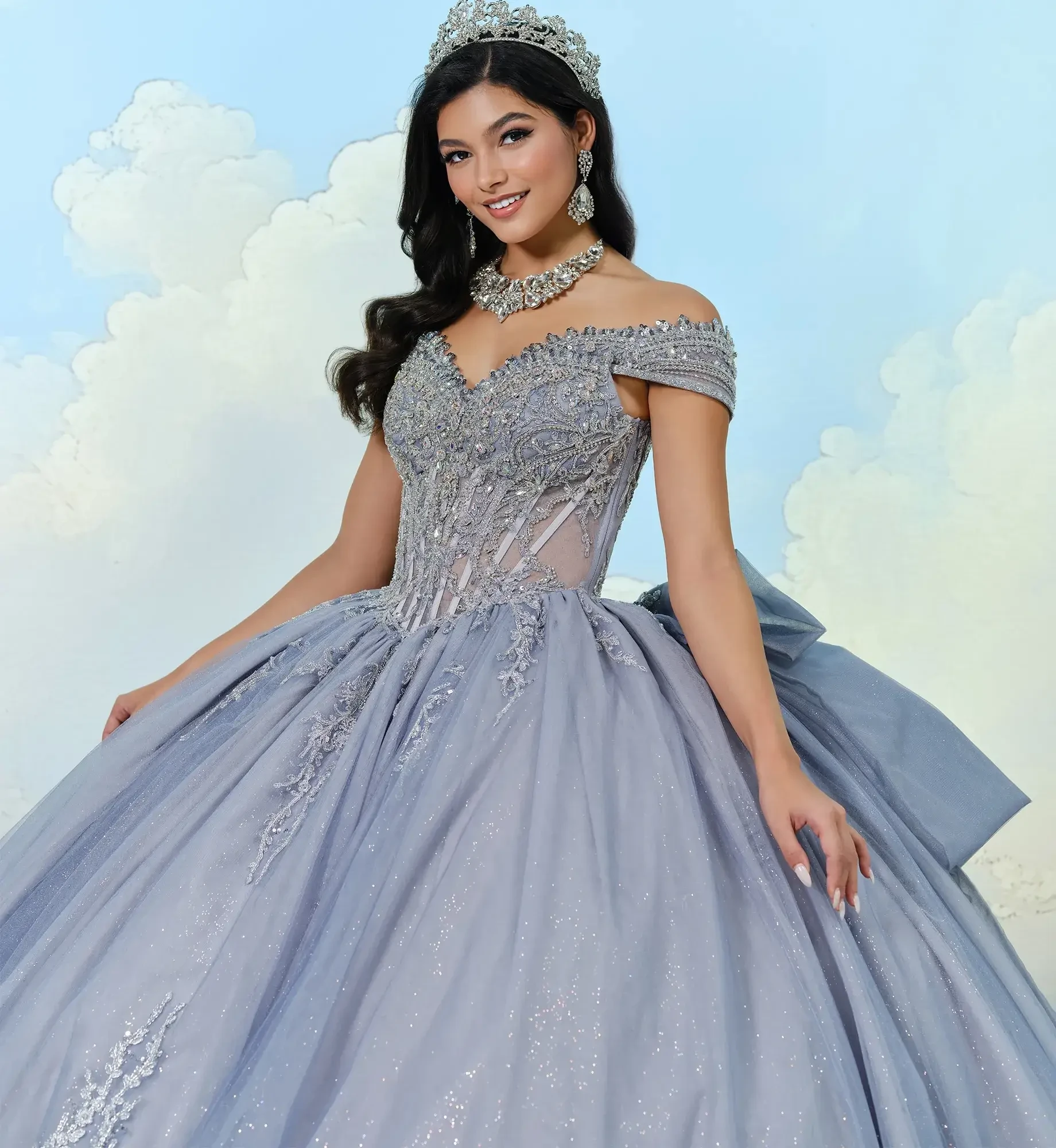 model is wearing an off the shoulder silver mist quince dress