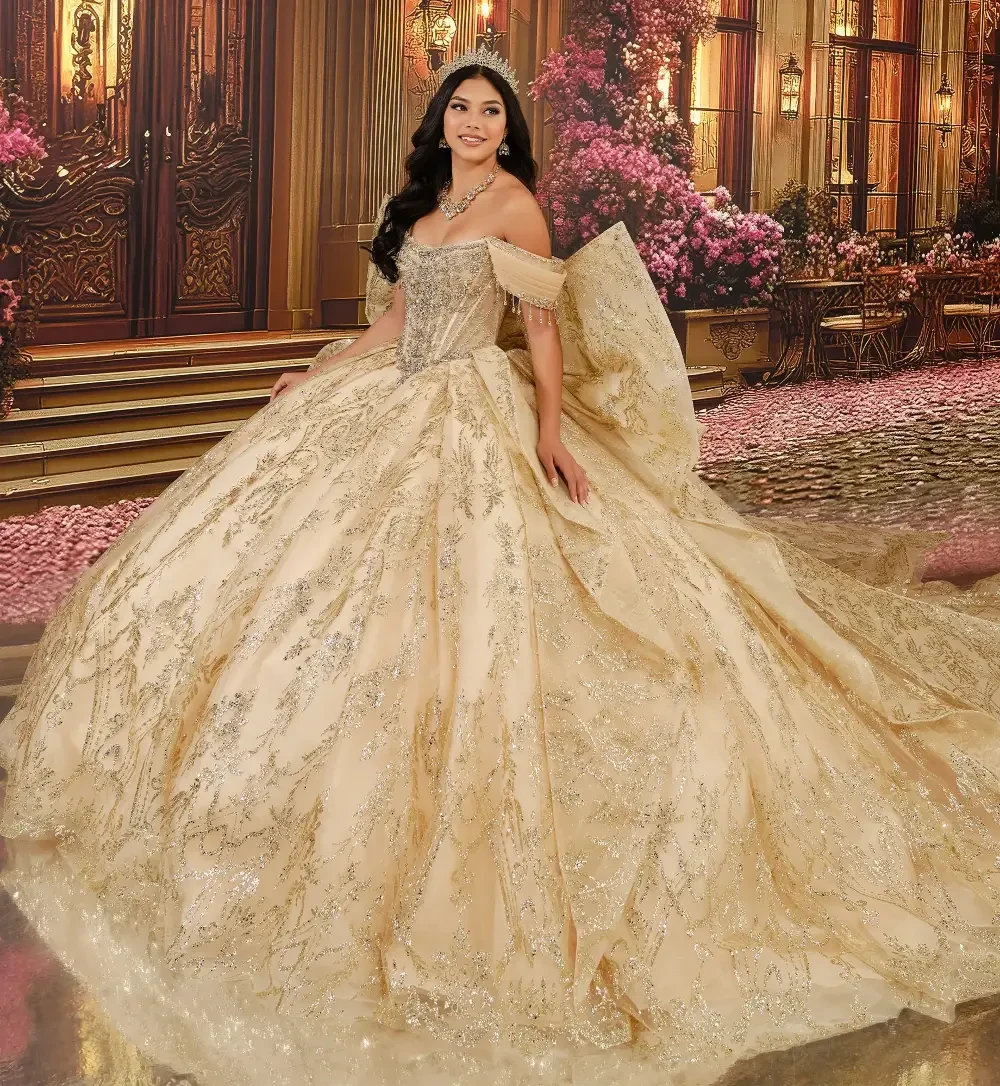 A woman in a luxurious golden ball gown with intricate designs, standing in an ornate setting with flowers and grand architecture in the background.