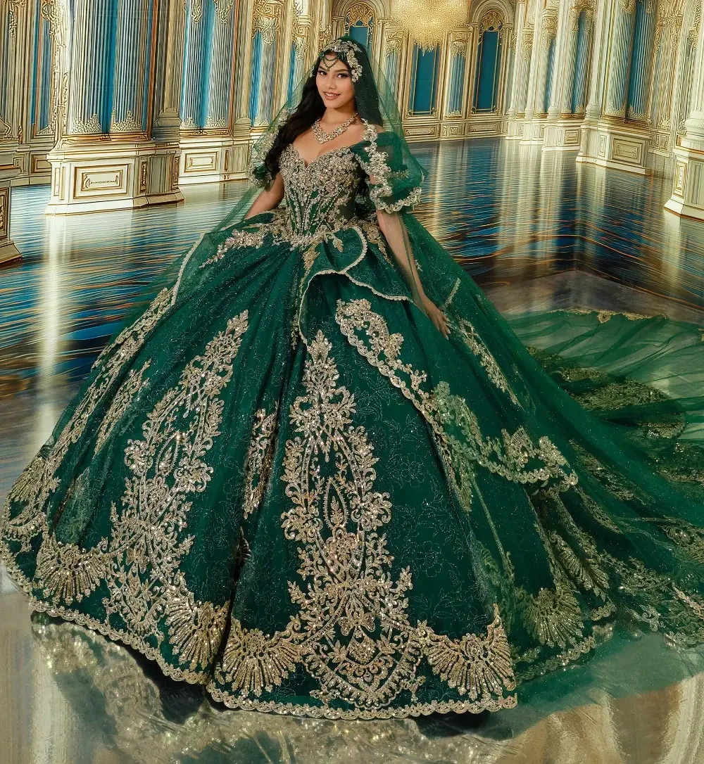 A woman in a lavish green gown with intricate gold embroidery, standing in an ornate, grand hall with mirrored flooring and elaborate architectural details.