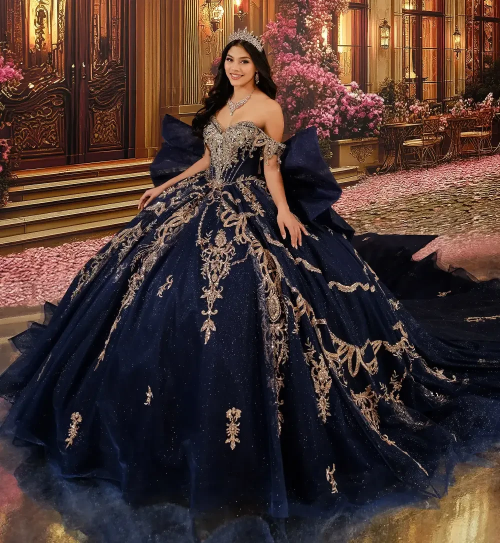 model is wearing an off the shoulder navy blue quinceanera gown