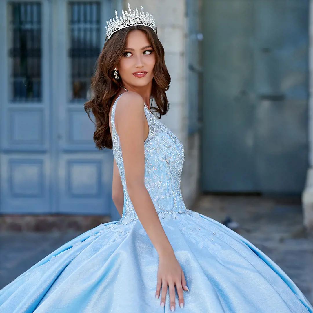 Model in light blue Princesa by Ariana Vara quinceañera dress