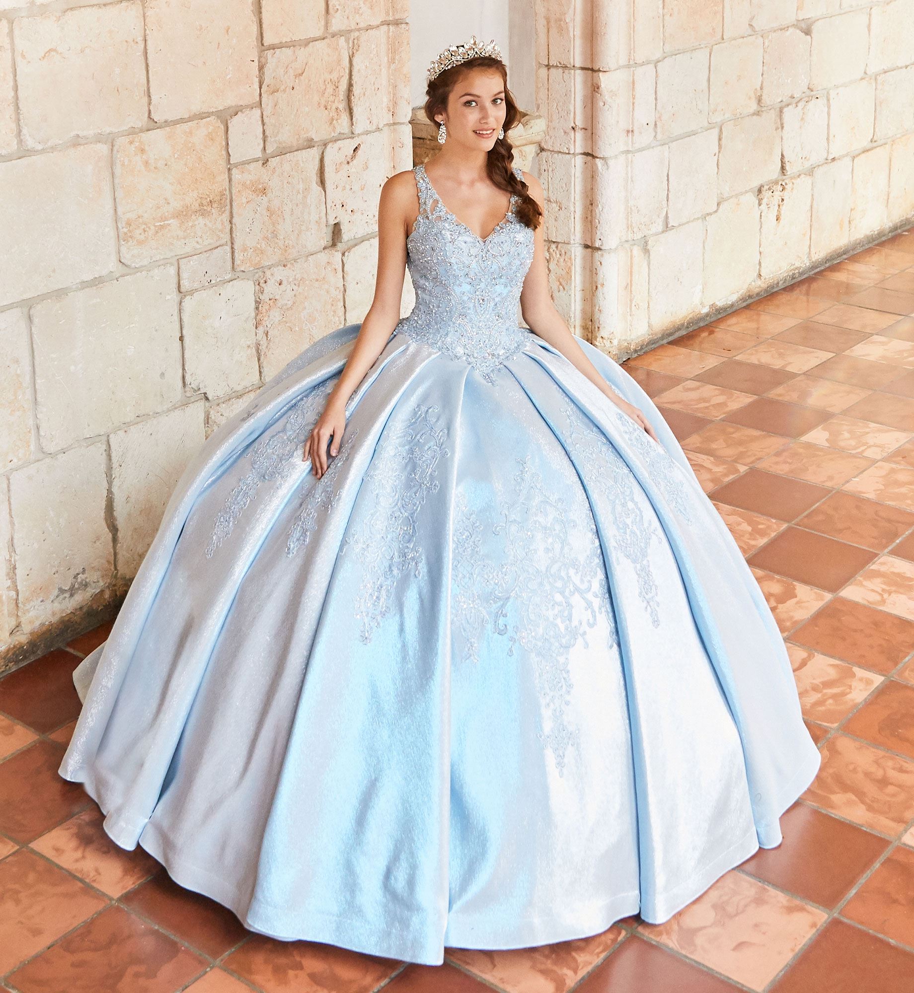 Brunette model in a blue quinceañera dress and tiara