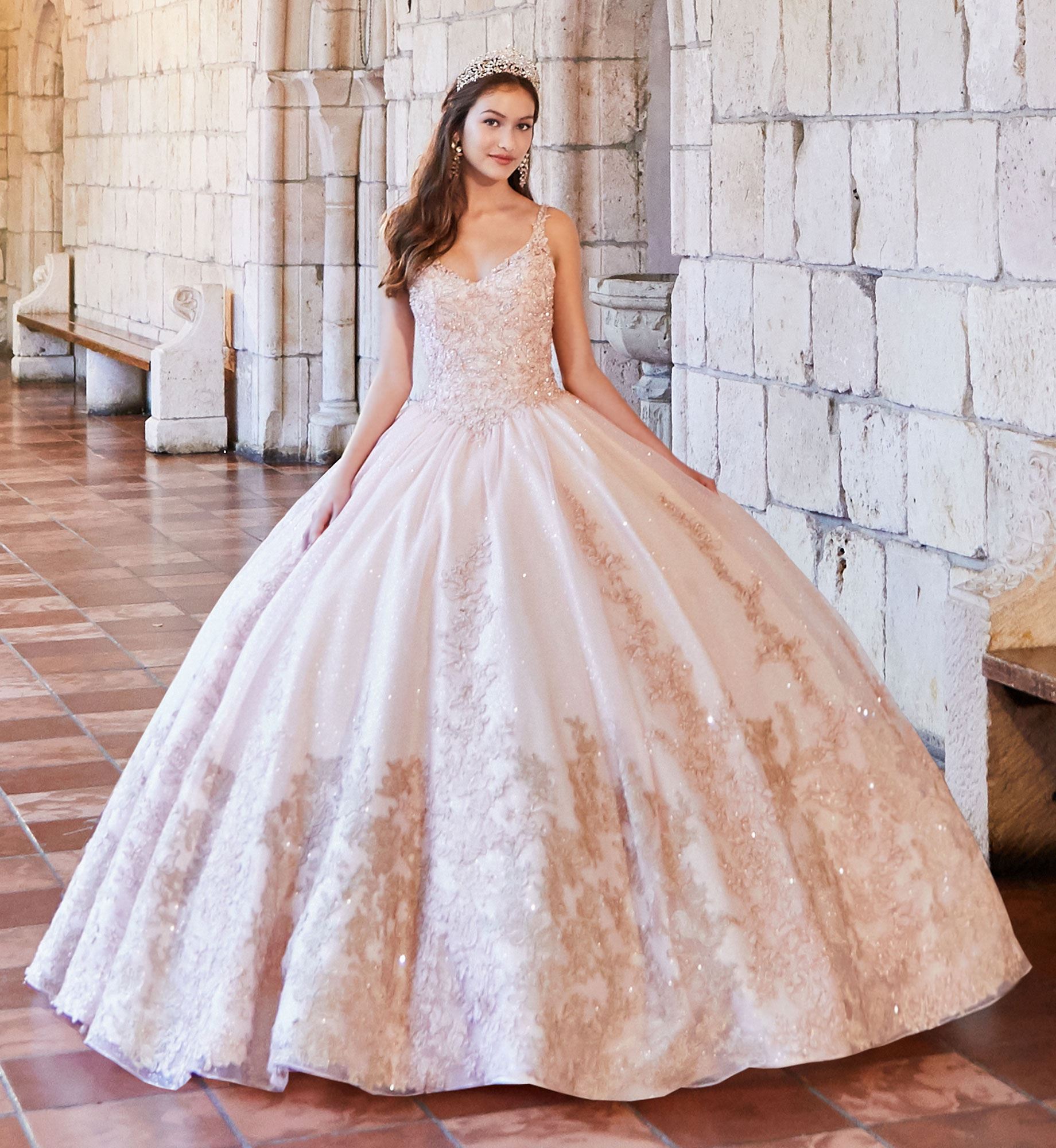 Brunette model in pink and gold quinceañera dress