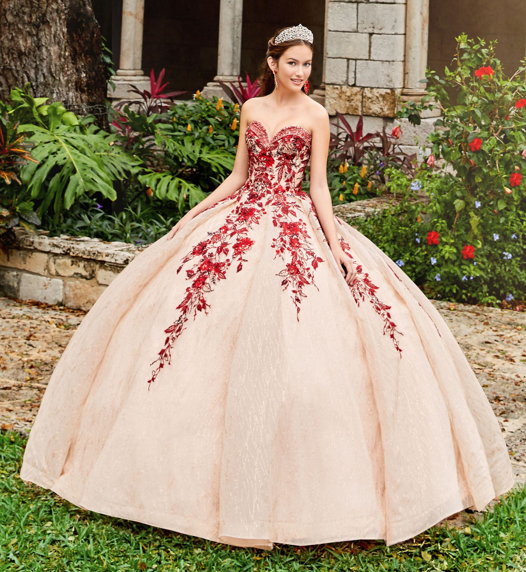 Brunette model in strapless red and gold quinceañera dress